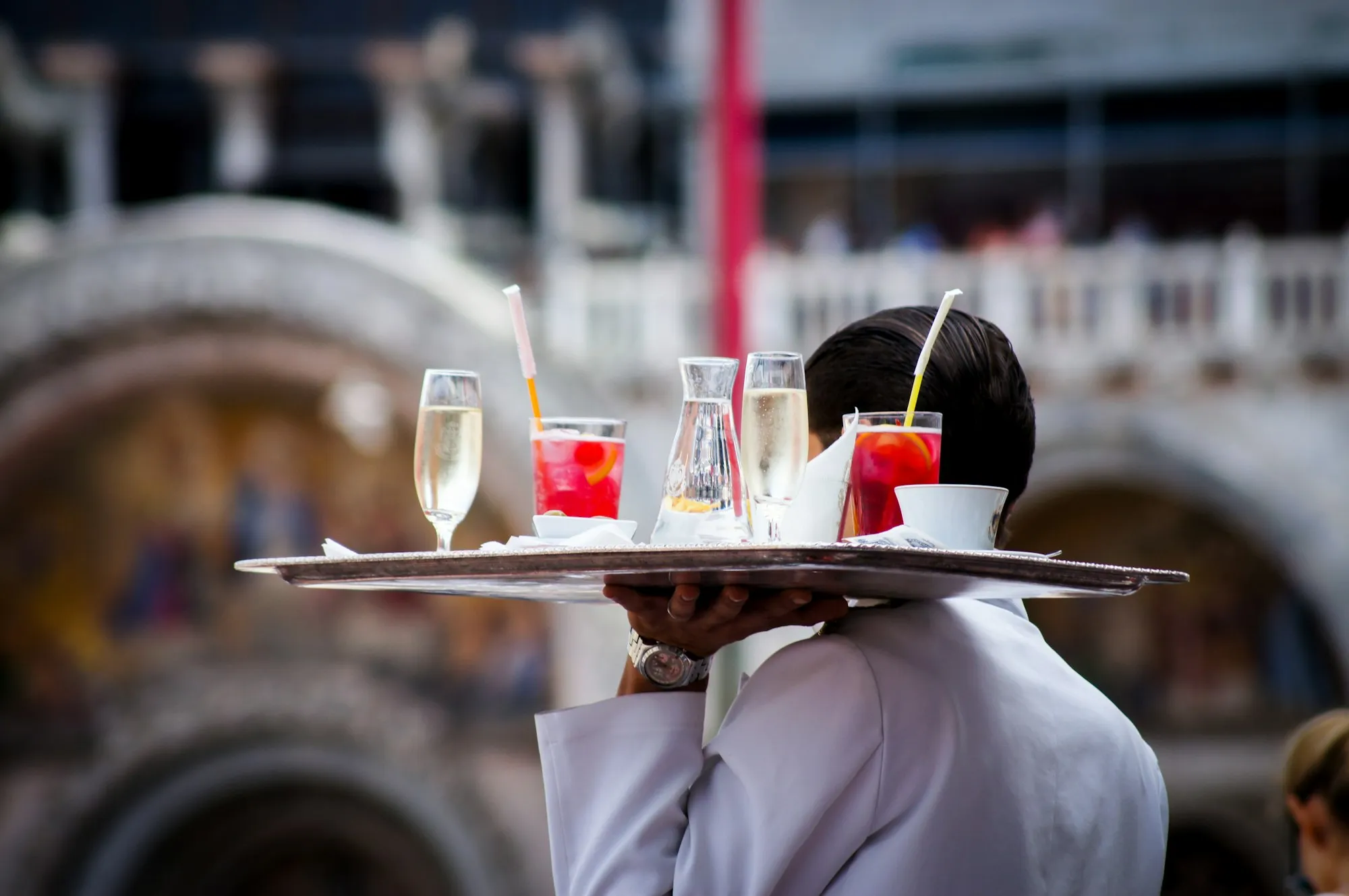 Bar worker serving drinks in a hospitality role