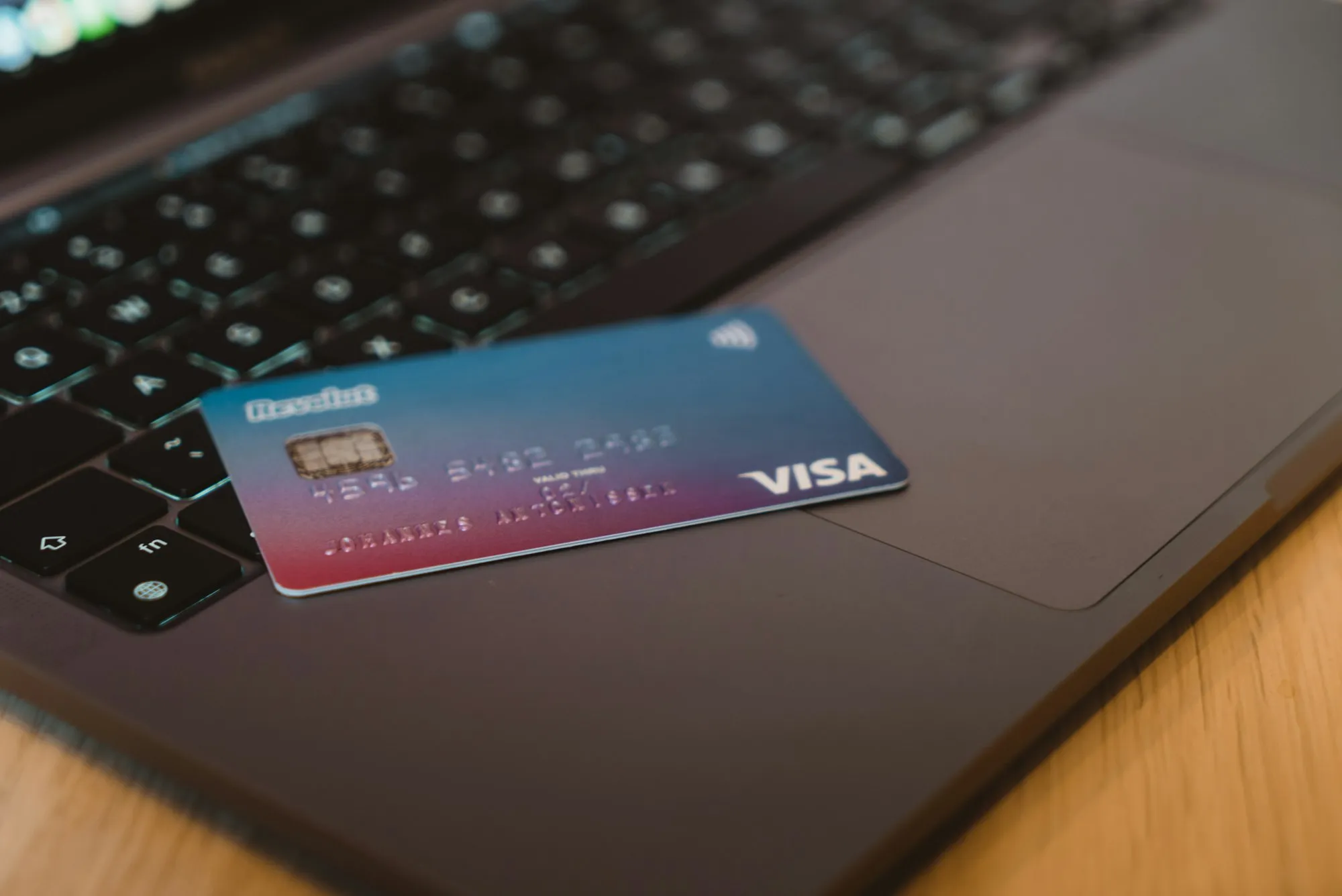 Bank card resting on a laptop keyboard