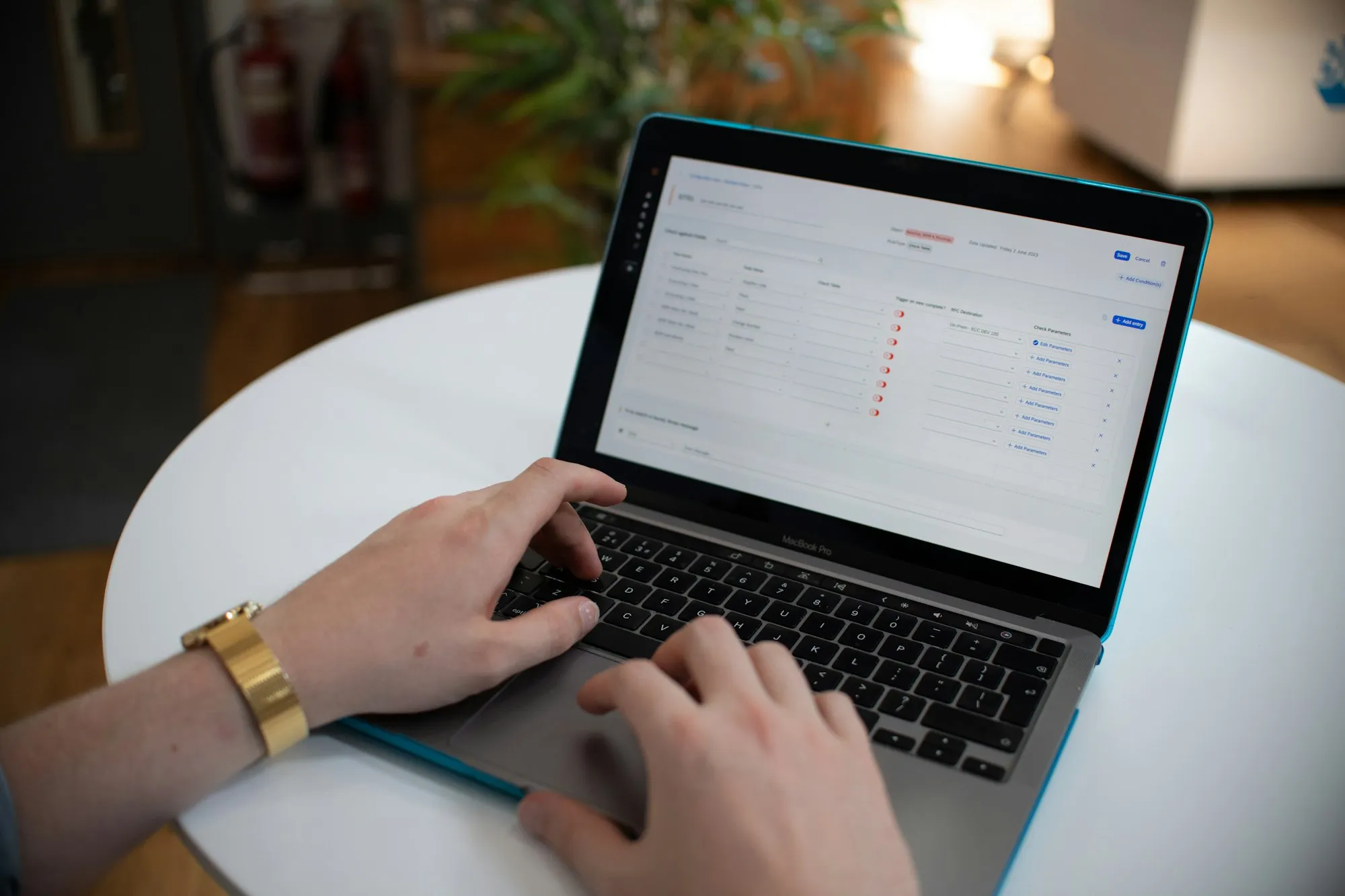 Hands typing on a laptop to fill in an online application